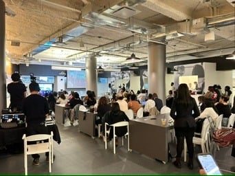 Attendees seated at an ADW Collective panel session.